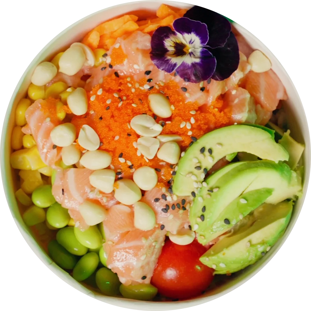A salmon poké bowl with masago, peanuts, avocado, tomato and an edible flower, seen from straight above