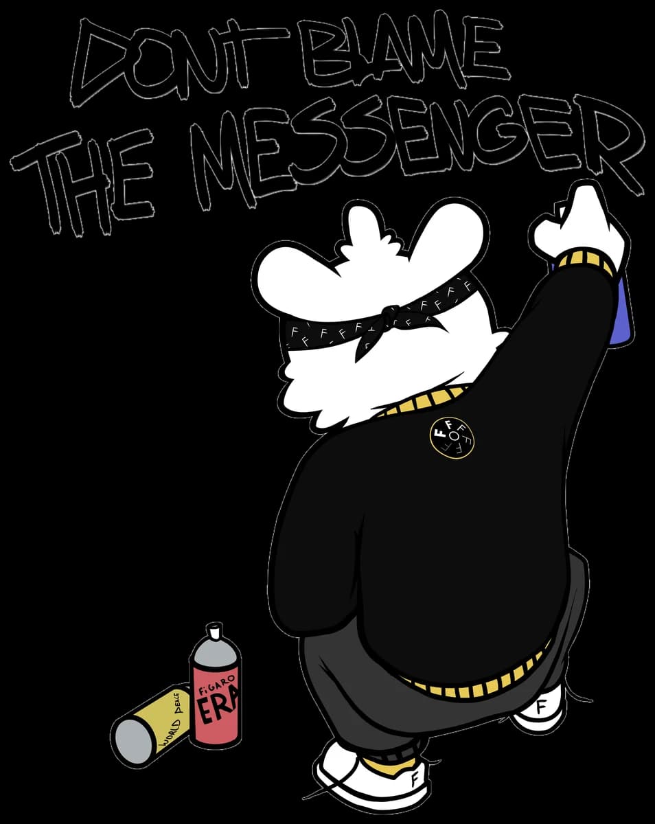 Figaro in a black sweater sprays the words Don't blame the messenger on a wall, with two spray cans beside him