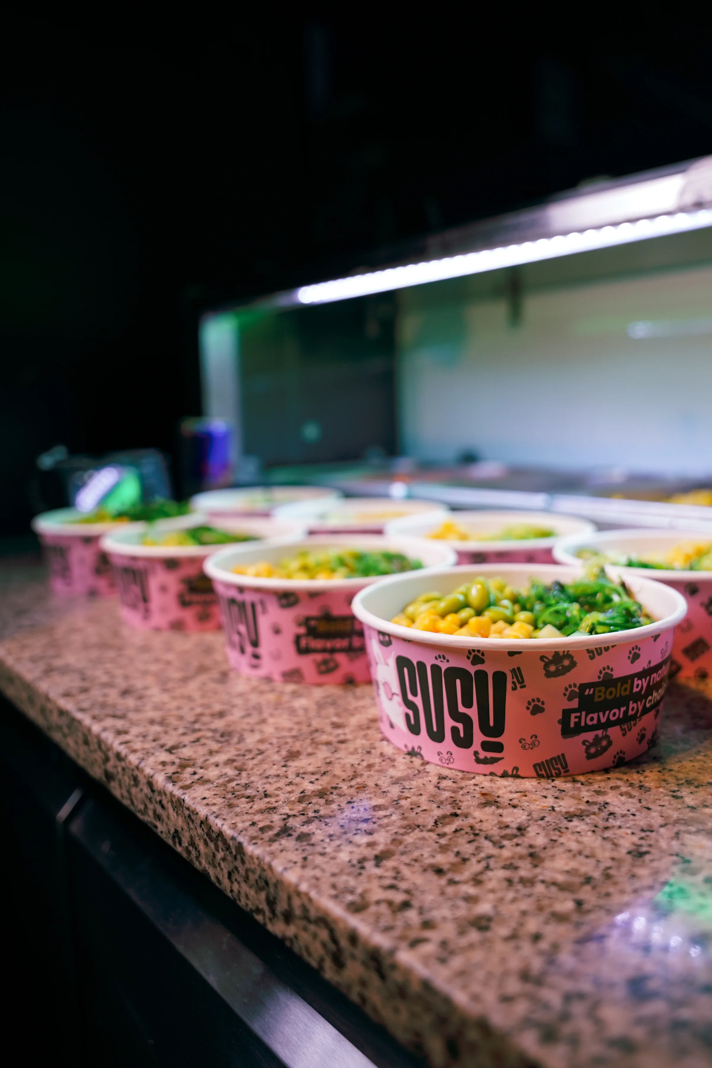 A row of filled SUSU bowls on the counter